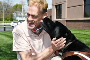Image of Alphapointe team member Danny Jones with his guide dog, Teton
