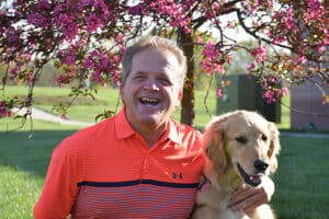 Image of Alphapointe team member Melvin Smith with his guide dog, Mercedes