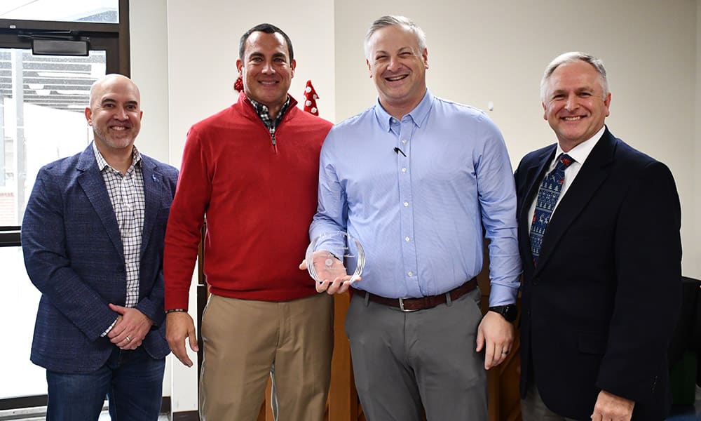Bank Midwest team members receiving their "Supplier of the Year" award from Alphapointe
