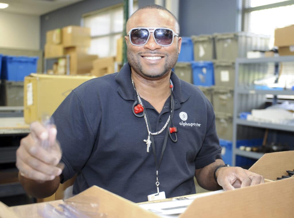 Romia works in Office Products at Alphapointe. Like me, he gets plenty of questions about his vision loss. 
