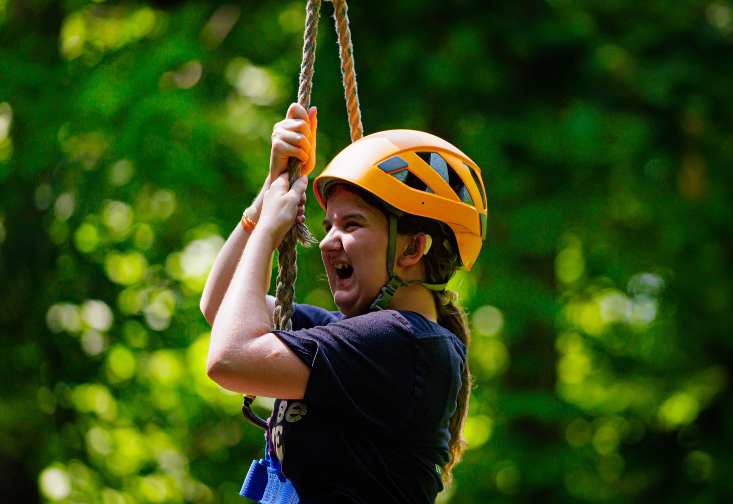 Peyton is riding down the zip line