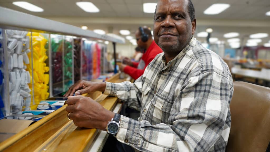 Robert is working in our Office Products Department. He is smiling at the camera.