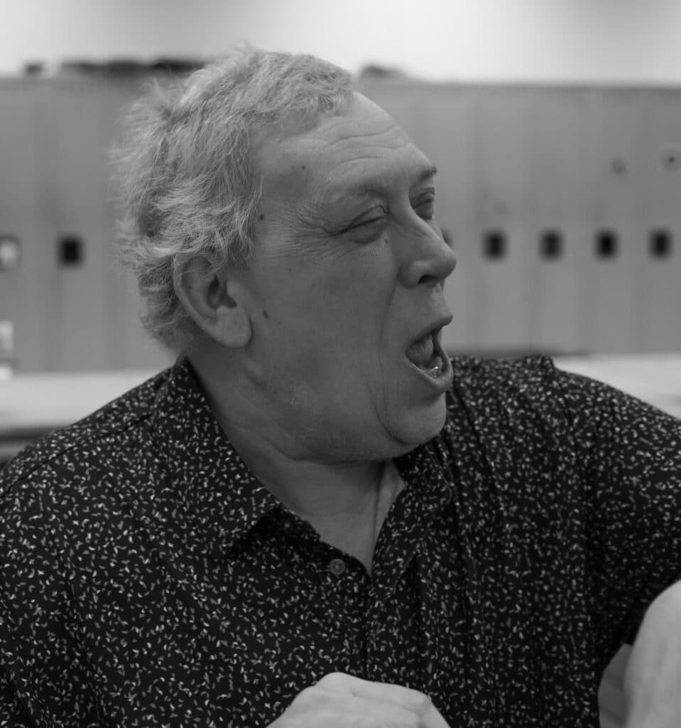 Three black and white pictures of Tom while working.