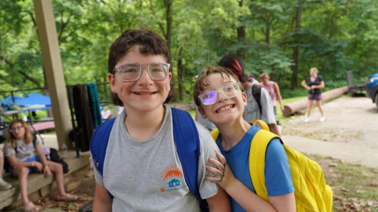 These campers are smiling at the camera during the Messy Olympics.