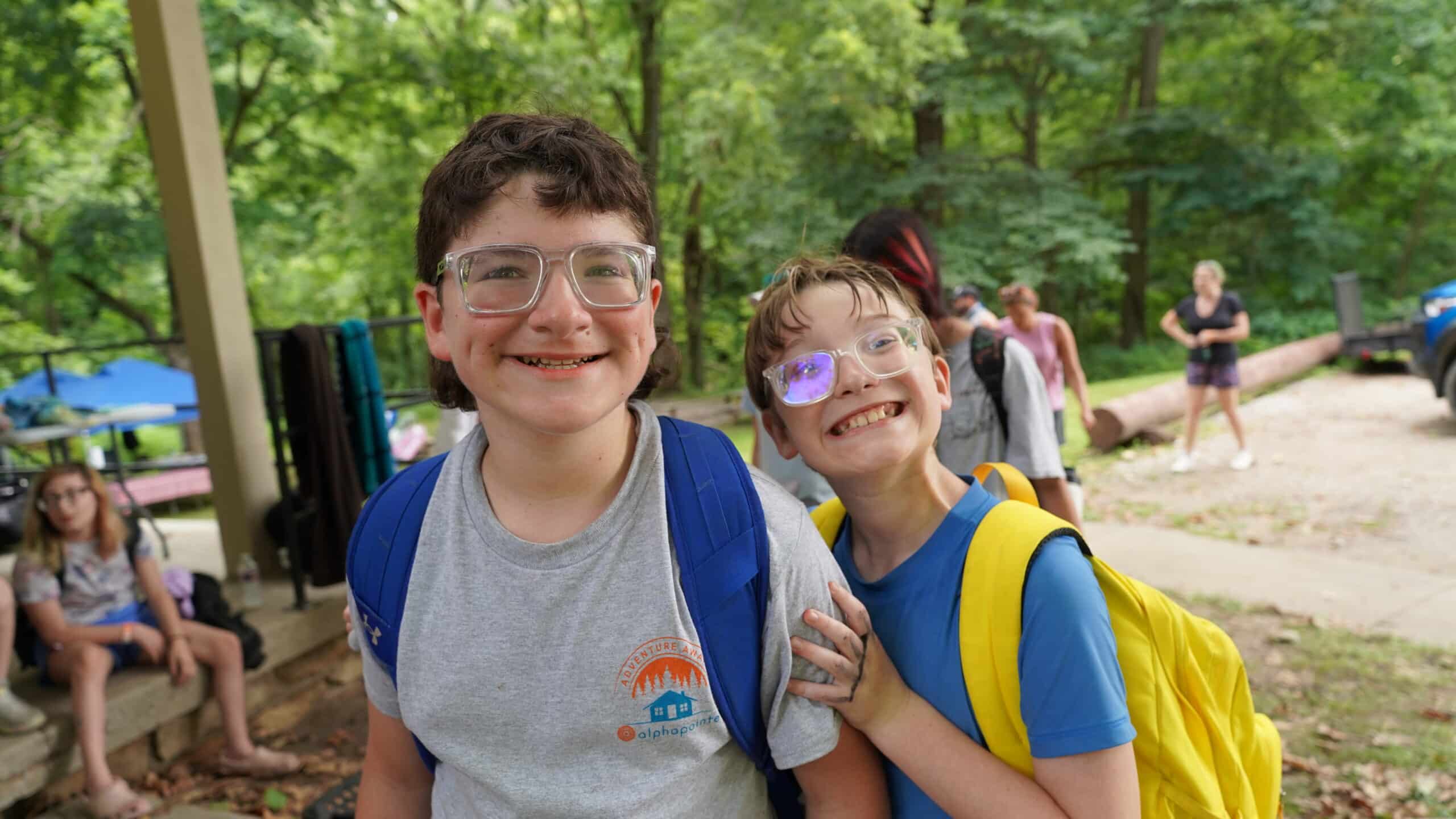 These campers are smiling at the camera during the Messy Olympics.