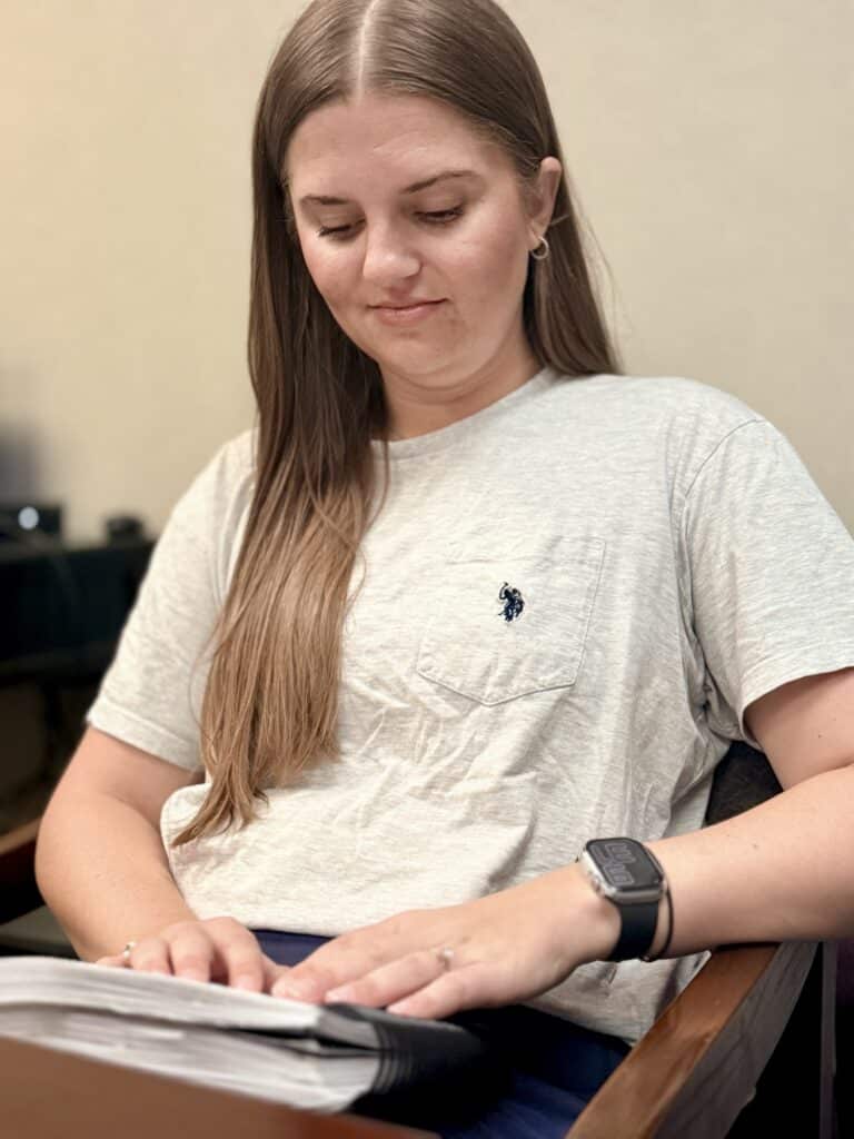 Riley is studying Braille in the Alphapointe classroom. 